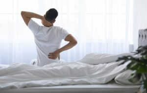 Unrecognizable,Young,Man,Waking,Up,In,Morning,With,Neck,And