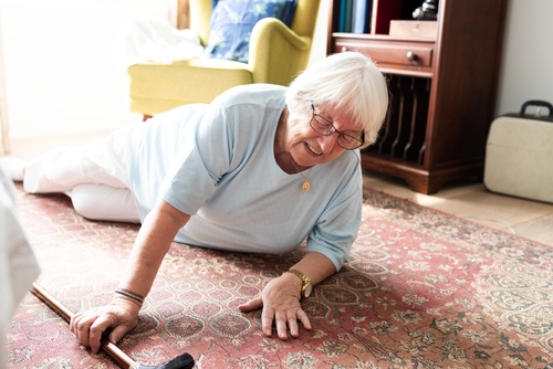 Elderly,Woman,On,The,Floor,,Reaching,For,Help.,Senior,Woman