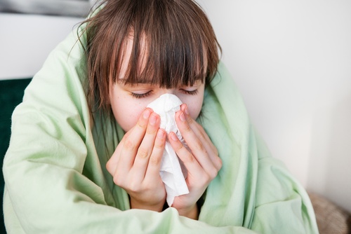 Sick,Teenager,Girl,Sneezing,At,Home,With,Cold,,Flu,,Or